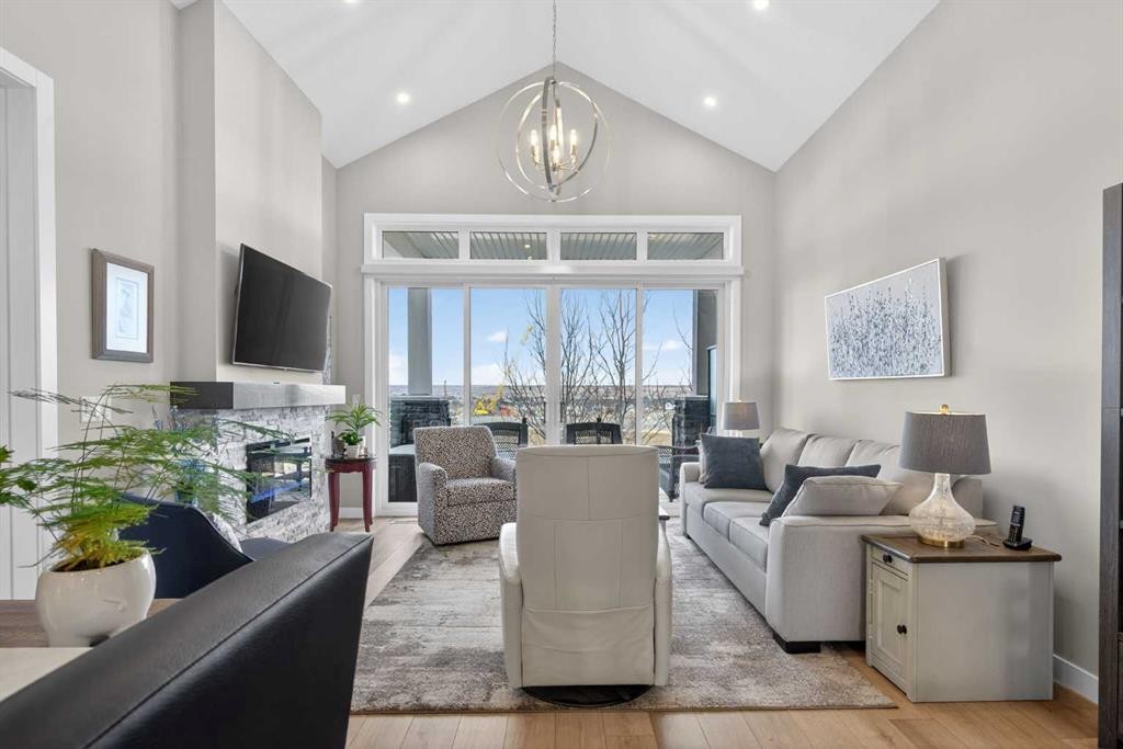 206 Crestridge Common Sw, Calgary, AB - Indoor Photo Showing Living Room With Fireplace