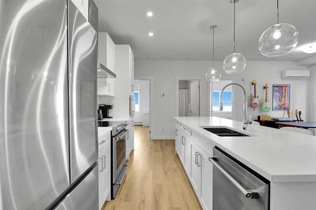 2216-200 Seton Circle Se, Calgary, AB - Indoor Photo Showing Kitchen With Double Sink With Upgraded Kitchen