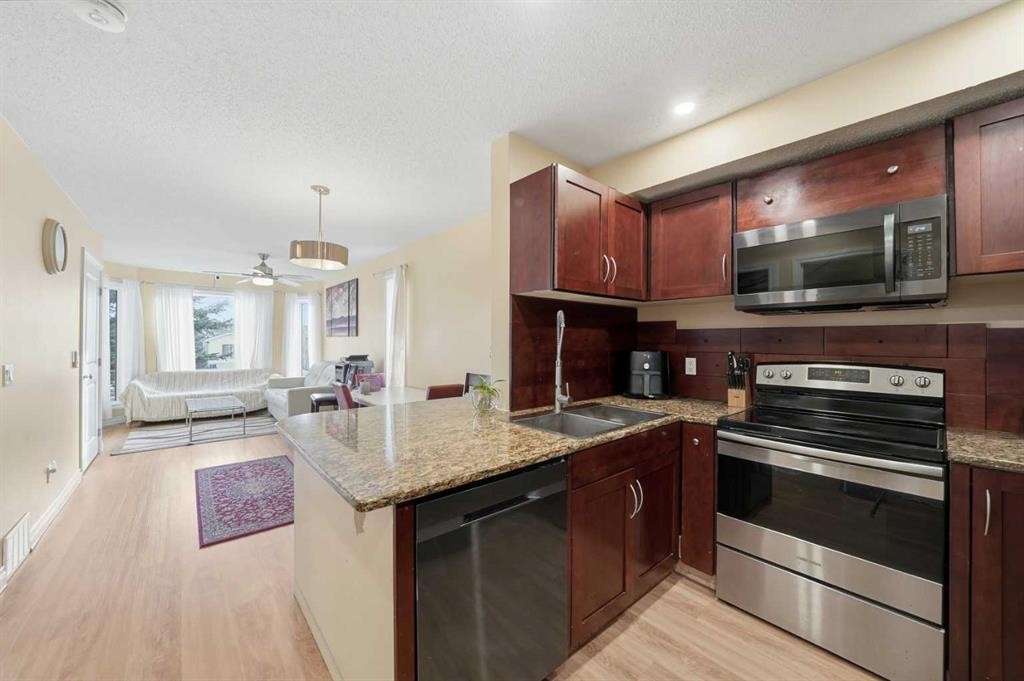 80 Taradale Drive South, Calgary, AB - Indoor Photo Showing Kitchen With Double Sink