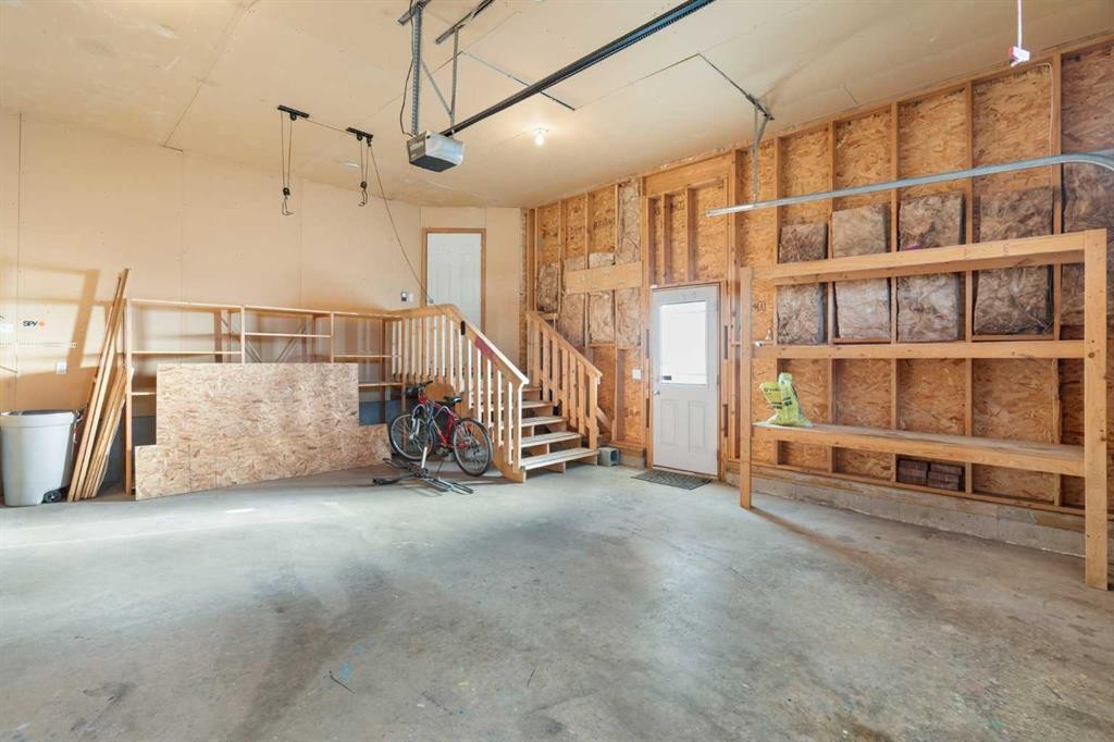 95 Cambridge Glen Drive, Strathmore, AB - Indoor Photo Showing Garage