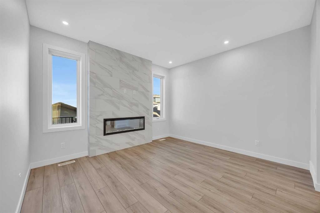 26 Versant Path Sw, Calgary, AB - Indoor With Fireplace