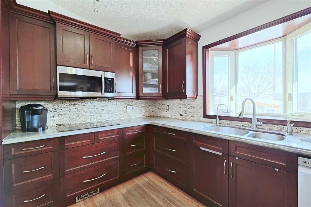 48 Bernard Way Nw, Calgary, AB - Indoor Photo Showing Kitchen With Double Sink