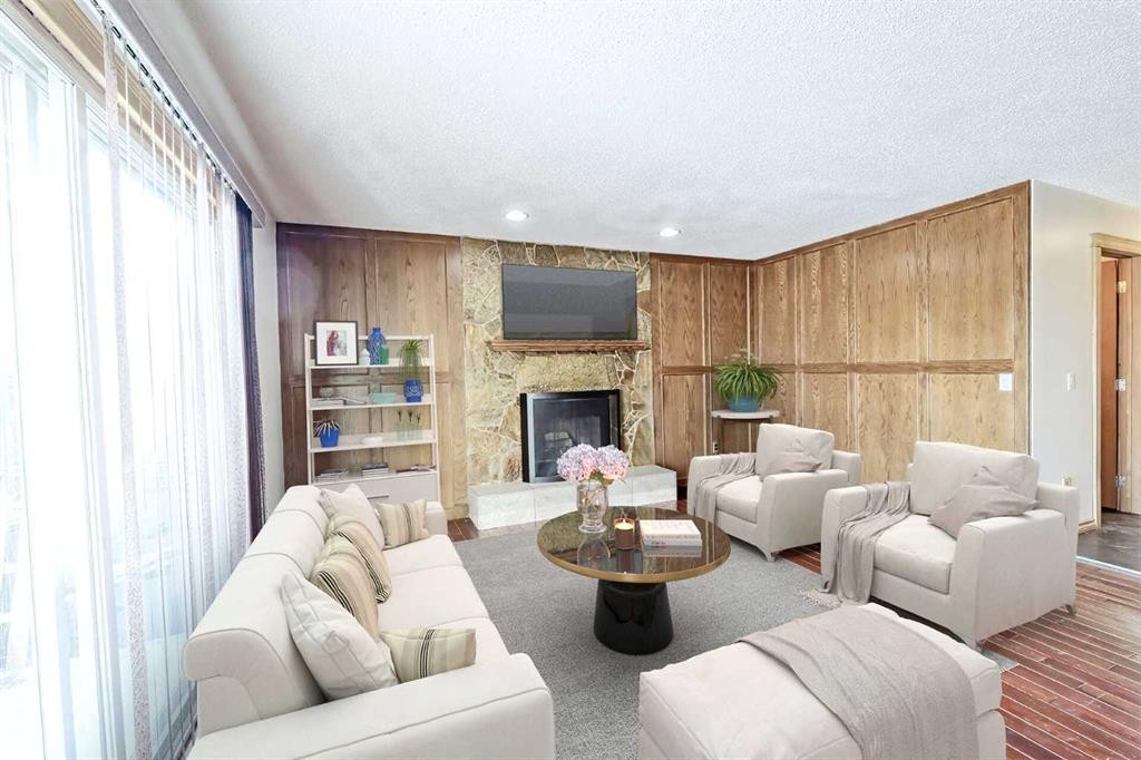 48 Bernard Way Nw, Calgary, AB - Indoor Photo Showing Living Room With Fireplace
