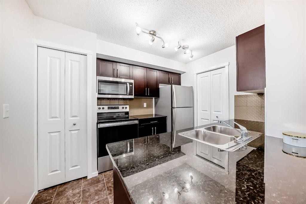 2324-81 Legacy Boulevard Se, Calgary, AB - Indoor Photo Showing Kitchen With Stainless Steel Kitchen With Double Sink With Upgraded Kitchen