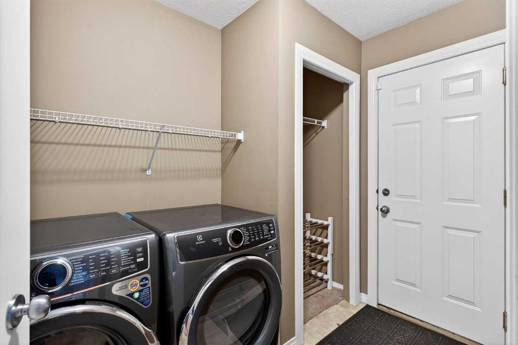 69 Elkton Way Sw, Calgary, AB - Indoor Photo Showing Laundry Room