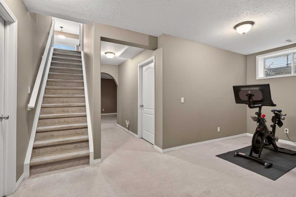 69 Elkton Way Sw, Calgary, AB - Indoor Photo Showing Gym Room