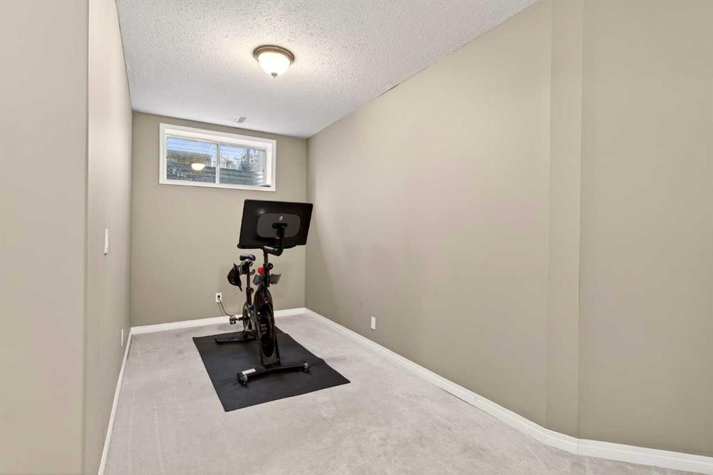 69 Elkton Way Sw, Calgary, AB - Indoor Photo Showing Gym Room