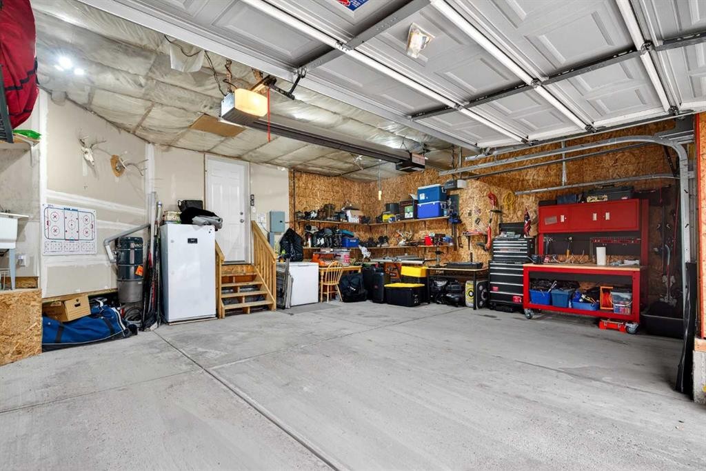 69 Elkton Way Sw, Calgary, AB - Indoor Photo Showing Garage