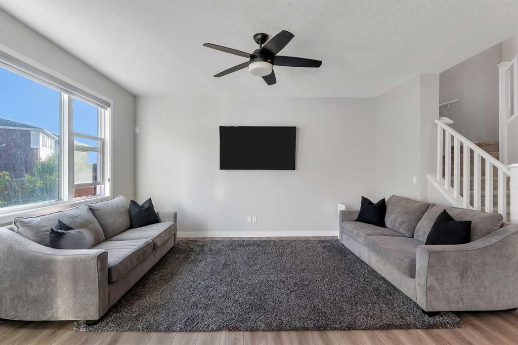 39 Savanna Way Ne, Calgary, AB - Indoor Photo Showing Living Room With Fireplace