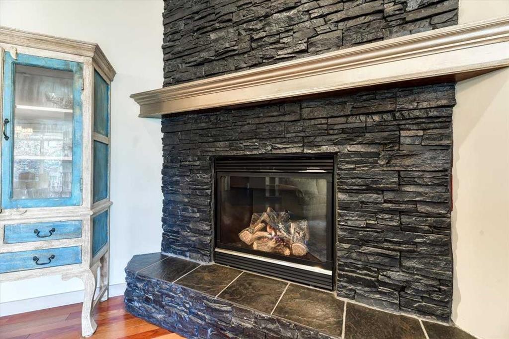 63 Discovery Ridge Circle Sw, Calgary, AB - Indoor Photo Showing Living Room With Fireplace