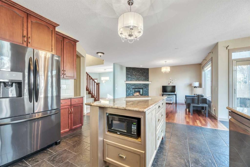 63 Discovery Ridge Circle Sw, Calgary, AB - Indoor Photo Showing Kitchen With Fireplace