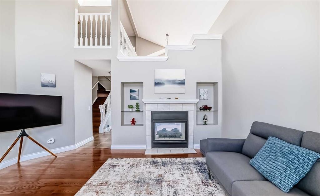 188 Hidden Ranch Crescent Nw, Calgary, AB - Indoor Photo Showing Living Room With Fireplace