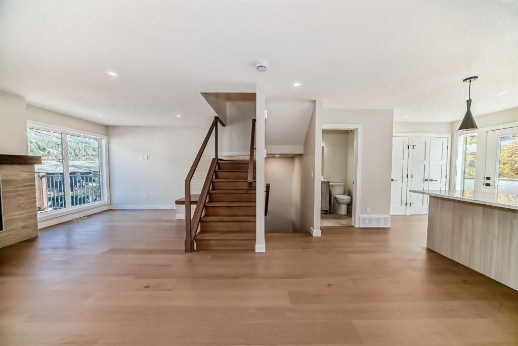 115-1330 1St Avenue, Canmore, AB - Indoor With Fireplace