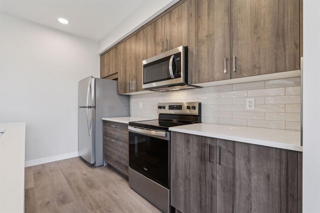 412-700 Shawnee Square Sw, Calgary, AB - Indoor Photo Showing Kitchen With Stainless Steel Kitchen