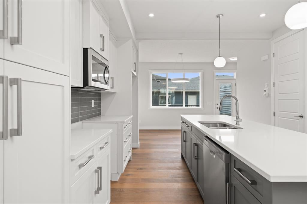 384 Sora Boulevard Se, Calgary, AB - Indoor Photo Showing Kitchen With Double Sink