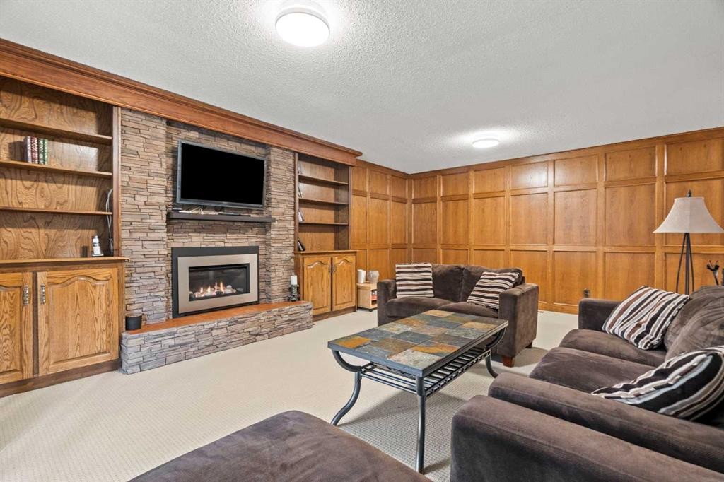 124 Canterbury Drive Sw, Calgary, AB - Indoor Photo Showing Living Room With Fireplace