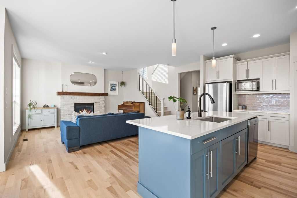 59 Cortina Way Sw, Calgary, AB - Indoor Photo Showing Kitchen With Fireplace With Upgraded Kitchen