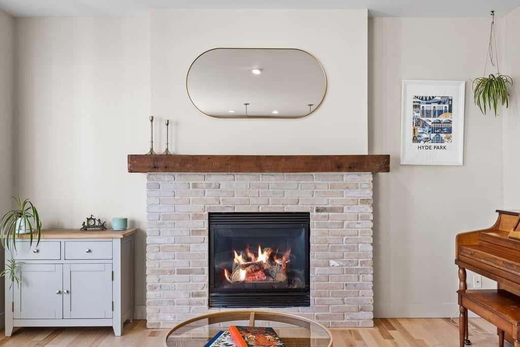 59 Cortina Way Sw, Calgary, AB - Indoor Photo Showing Living Room With Fireplace