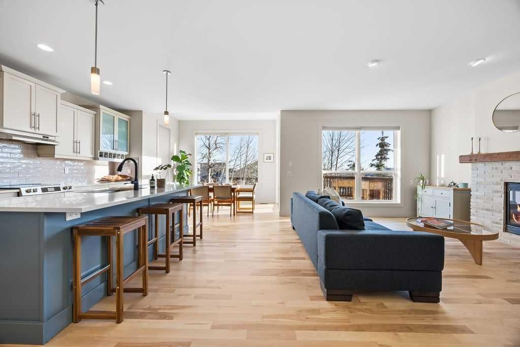 59 Cortina Way Sw, Calgary, AB - Indoor Photo Showing Other Room With Fireplace