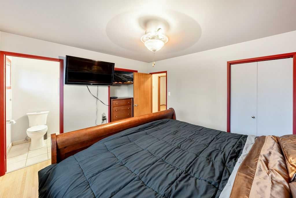 9136 Allison Drive Se, Calgary, AB - Indoor Photo Showing Bedroom