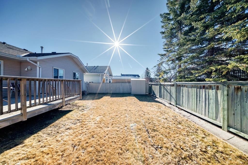 32 West Mackay Crescent, Cochrane, AB - Outdoor With Deck Patio Veranda With Exterior