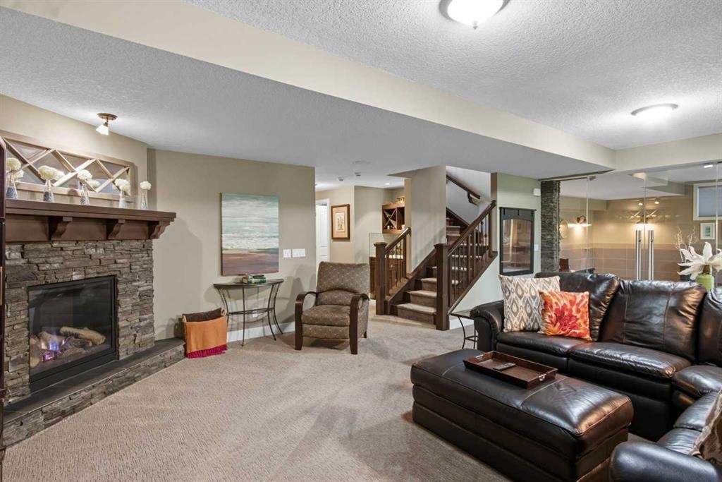 41 Evergreen Mount Sw, Calgary, AB - Indoor Photo Showing Living Room With Fireplace