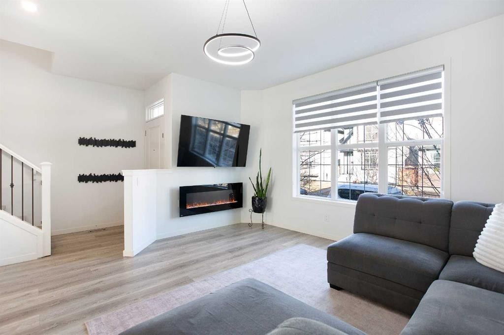 247 Cranford Way Se, Calgary, AB - Indoor Photo Showing Living Room With Fireplace