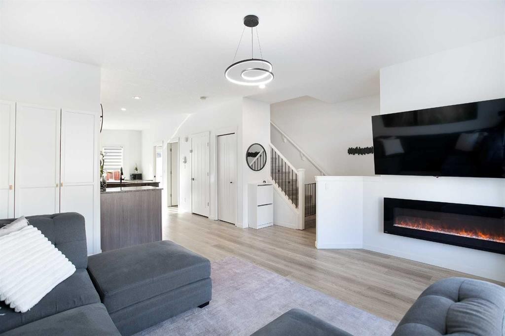 247 Cranford Way Se, Calgary, AB - Indoor Photo Showing Living Room With Fireplace