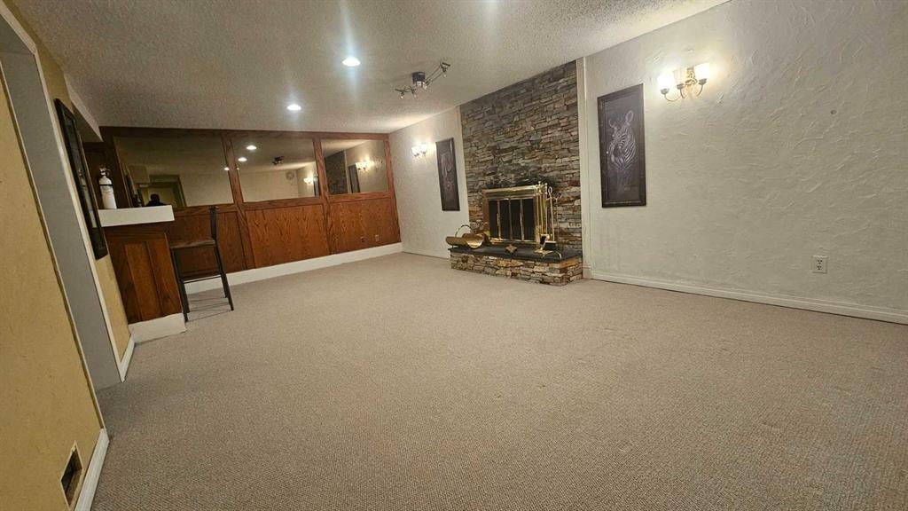 4 Clarendon Road Nw, Calgary, AB - Indoor Photo Showing Other Room With Fireplace