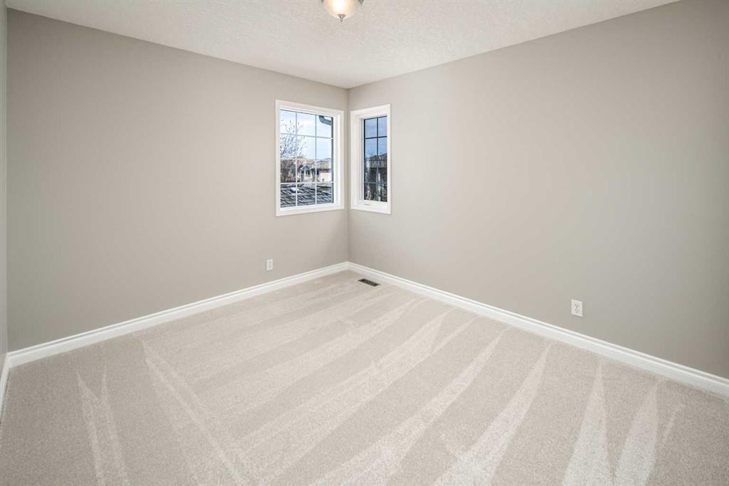 79 Hamptons Heights Nw, Calgary, AB - Indoor Photo Showing Other Room