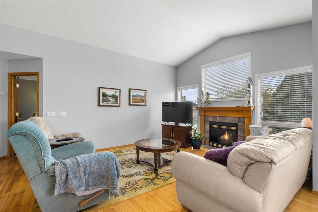 310 Riverside Garden Nw, High River, AB - Indoor Photo Showing Living Room With Fireplace