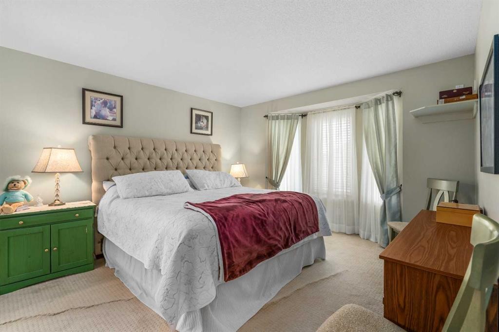 310 Riverside Garden Nw, High River, AB - Indoor Photo Showing Bedroom