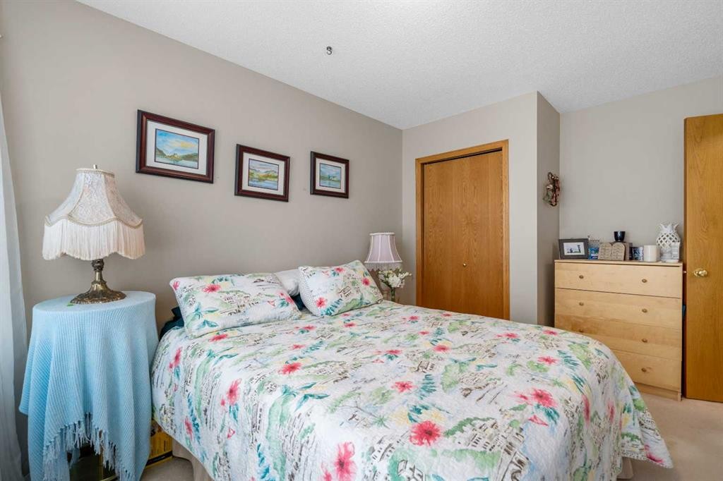 310 Riverside Garden Nw, High River, AB - Indoor Photo Showing Bedroom