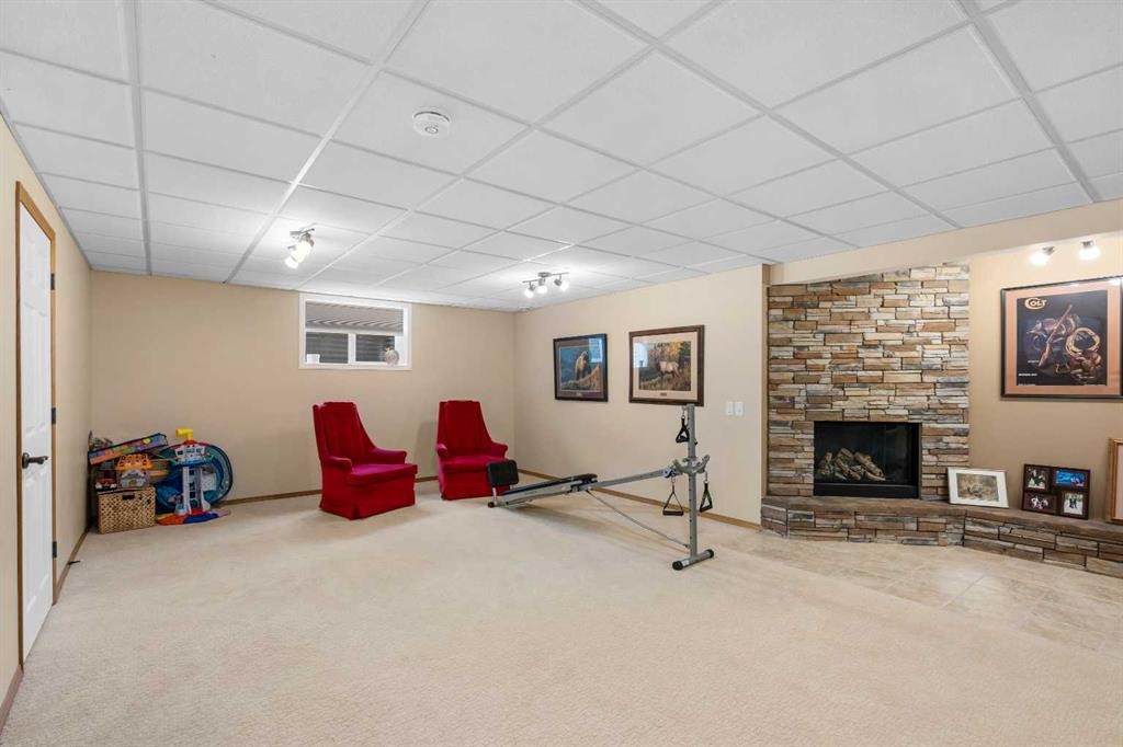 310 Riverside Garden Nw, High River, AB - Indoor With Fireplace