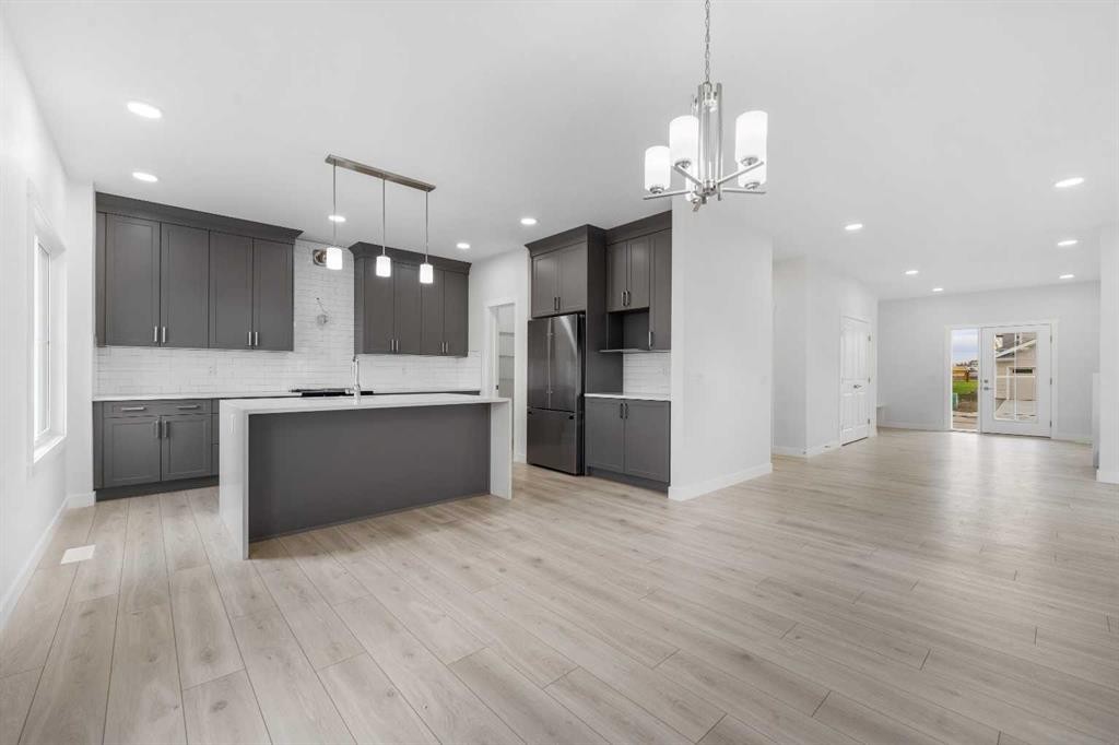 142 Sunstone Way, Balzac, AB - Indoor Photo Showing Kitchen With Upgraded Kitchen