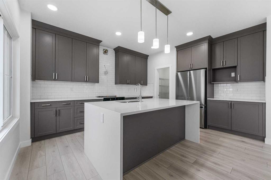 142 Sunstone Way, Balzac, AB - Indoor Photo Showing Kitchen With Upgraded Kitchen