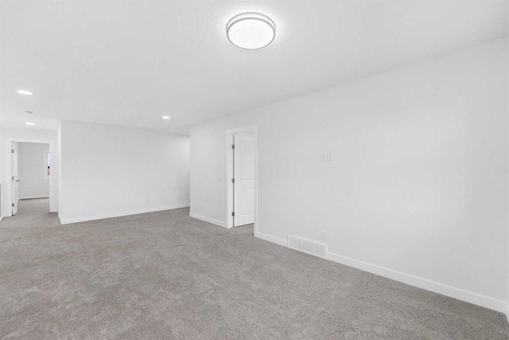 142 Sunstone Way, Balzac, AB - Indoor Photo Showing Other Room