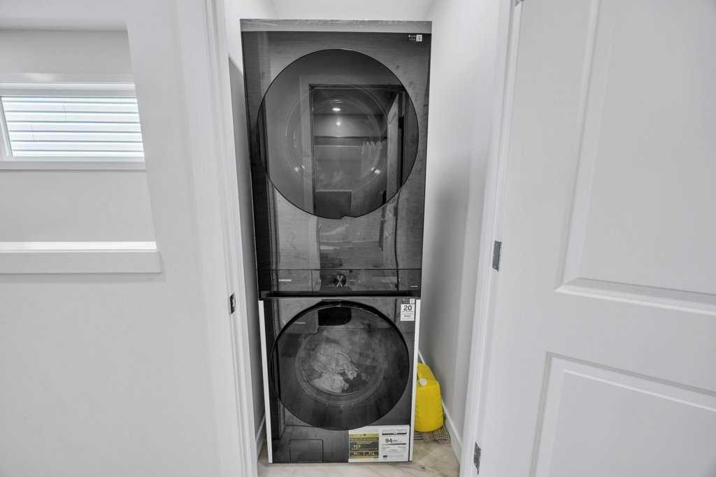 1612 Rangeview Drive Se, Calgary, AB - Indoor Photo Showing Laundry Room