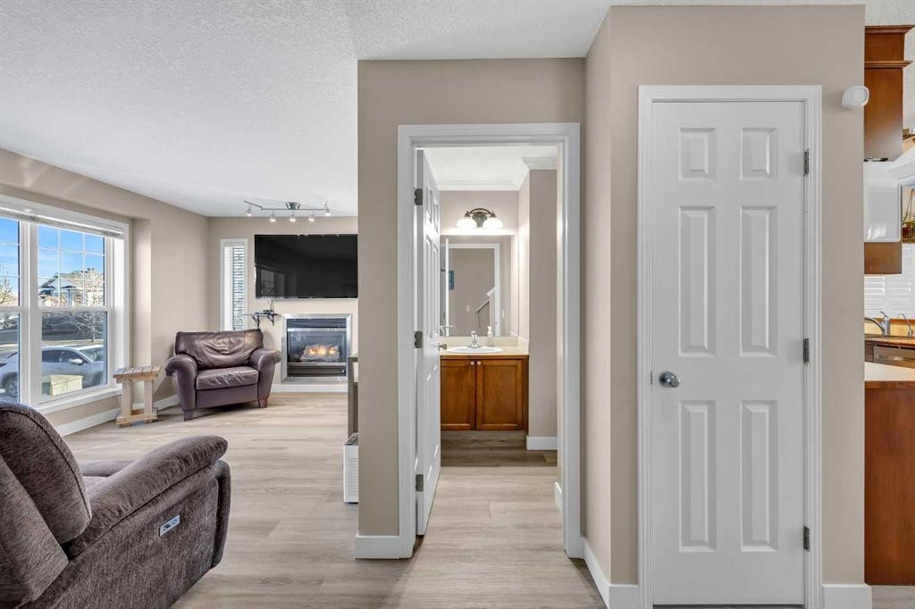 71 Eversyde Heath Sw, Calgary, AB - Indoor Photo Showing Living Room With Fireplace