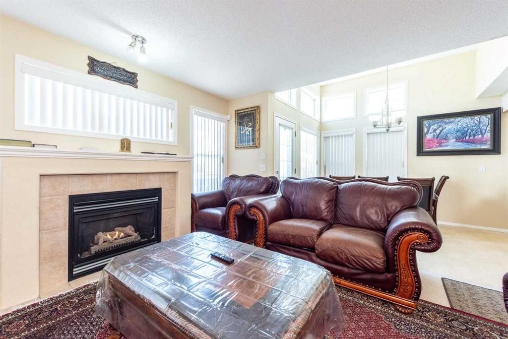 84 Tarington Way Ne, Calgary, AB - Indoor Photo Showing Living Room With Fireplace