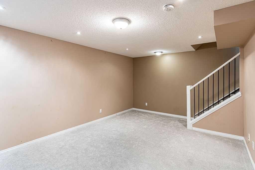 13 Coville Gardens Ne, Calgary, AB - Indoor Photo Showing Other Room