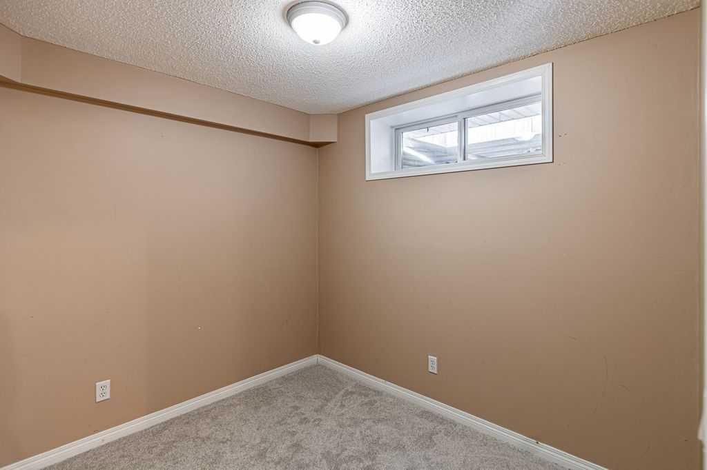 13 Coville Gardens Ne, Calgary, AB - Indoor Photo Showing Other Room