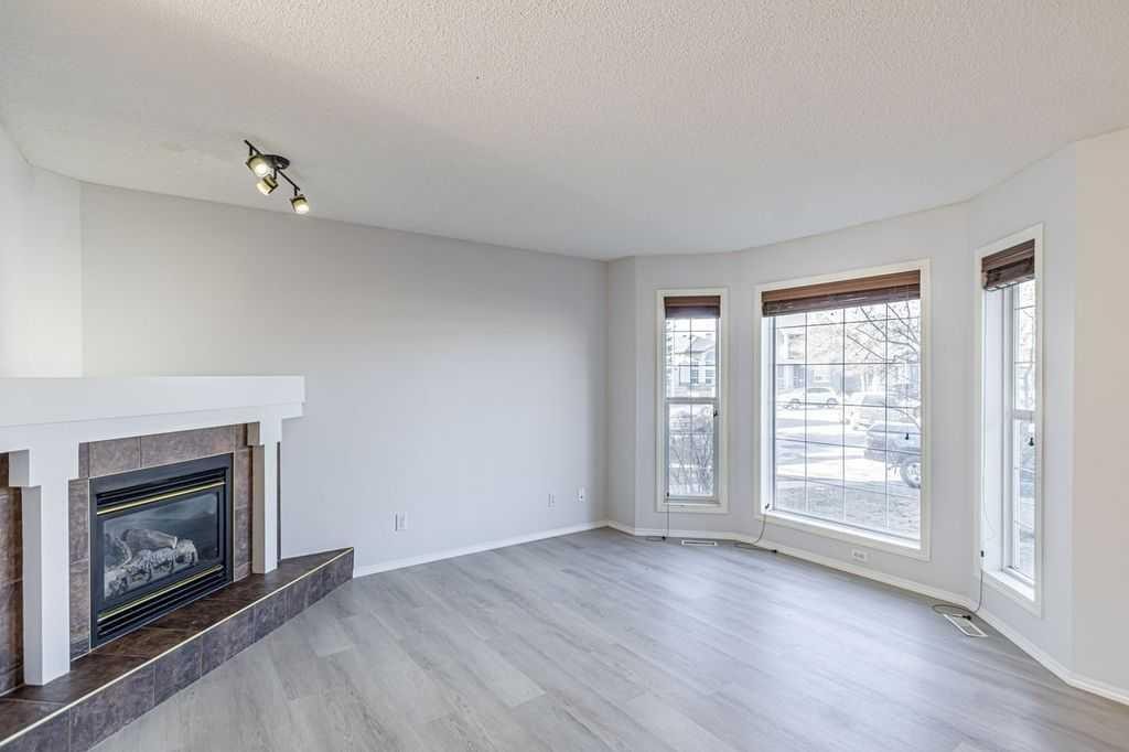 13 Coville Gardens Ne, Calgary, AB - Indoor Photo Showing Living Room With Fireplace