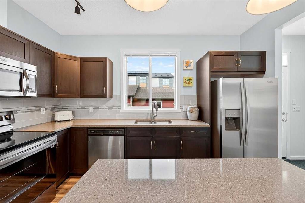 82 Mahogany Drive Se, Calgary, AB - Indoor Photo Showing Kitchen With Stainless Steel Kitchen With Double Sink