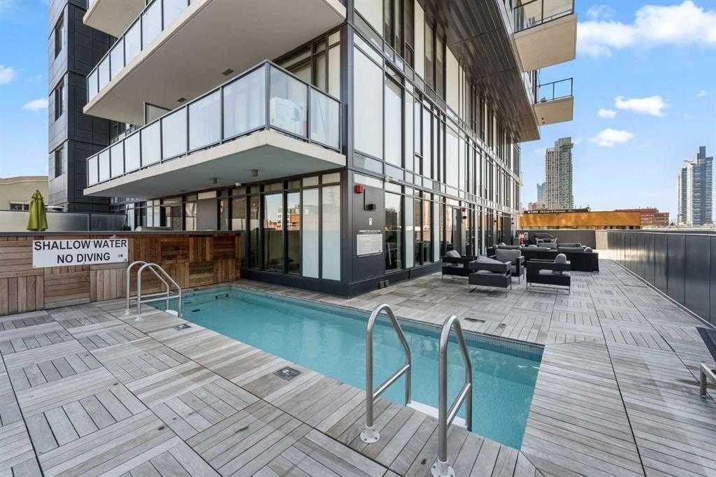 1207-1010 6 Street Sw, Calgary, AB - Outdoor With In Ground Pool With Exterior