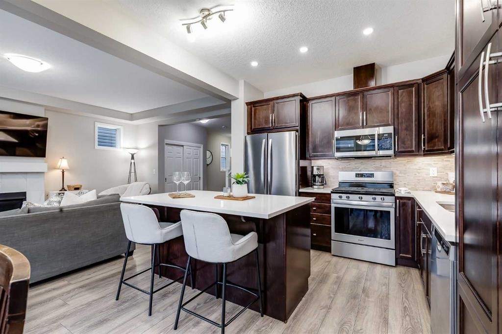 22 Osborne Common Sw, Airdrie, AB - Indoor Photo Showing Kitchen With Stainless Steel Kitchen