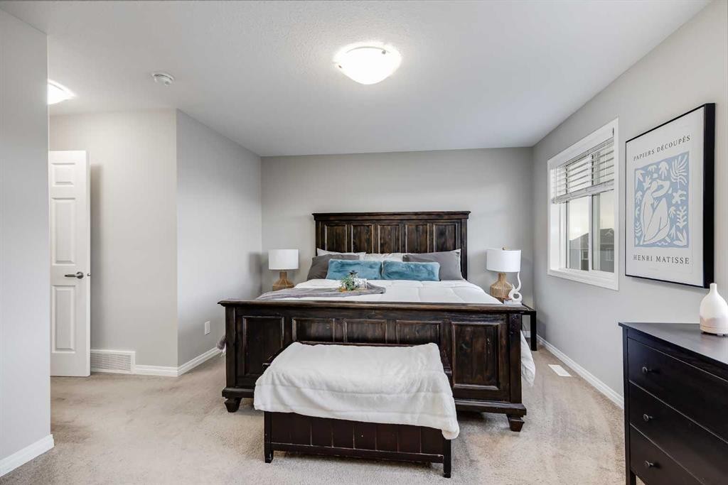 22 Osborne Common Sw, Airdrie, AB - Indoor Photo Showing Bedroom