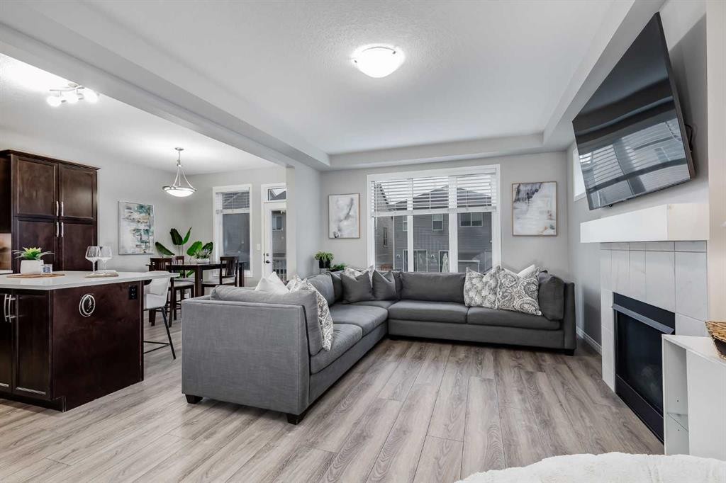 22 Osborne Common Sw, Airdrie, AB - Indoor Photo Showing Living Room With Fireplace