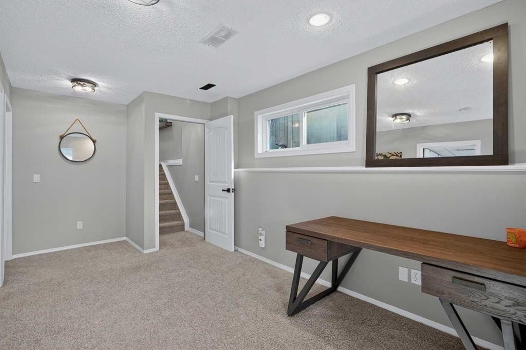 107 Mt Allan Circle Se, Calgary, AB - Indoor Photo Showing Other Room