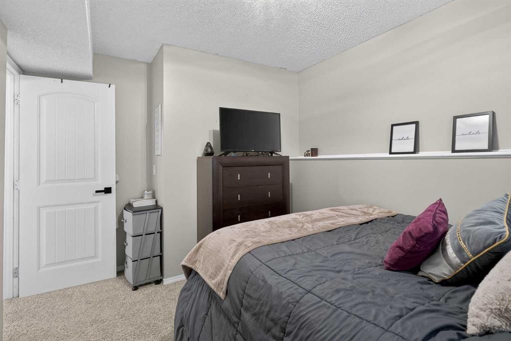 107 Mt Allan Circle Se, Calgary, AB - Indoor Photo Showing Bedroom